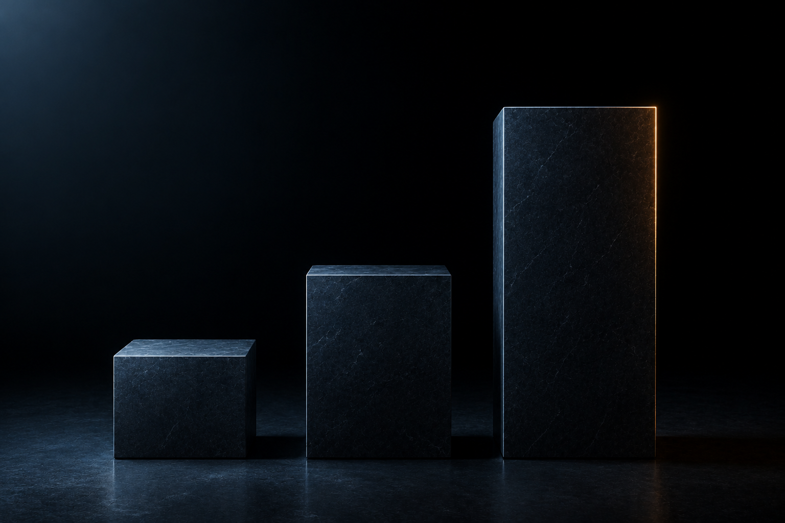 Three dark stone blocks in a row, each taller than the last, the tallest rimmed with warm light