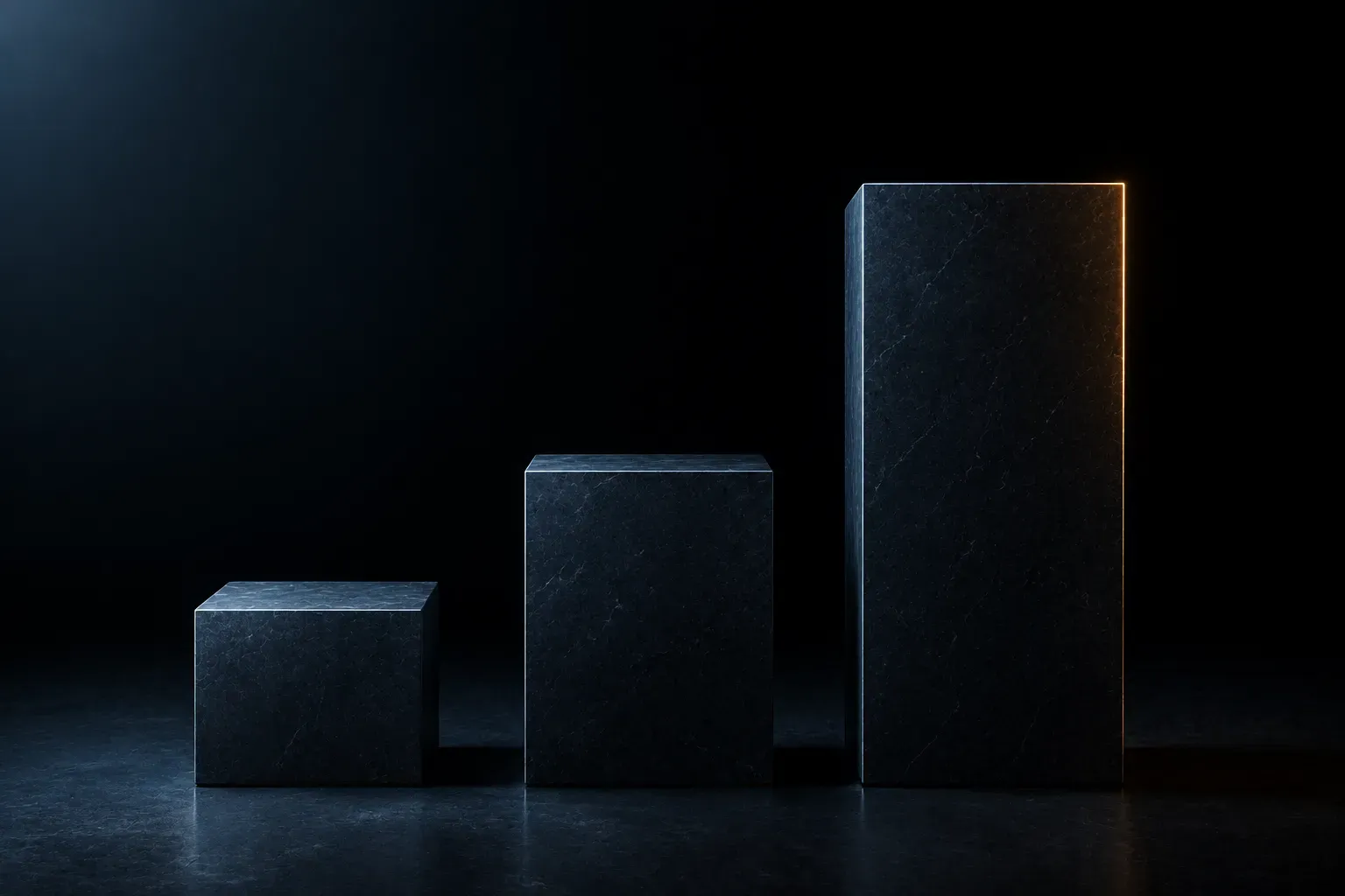 Three dark stone blocks in a row, each taller than the last, the tallest rimmed with warm light