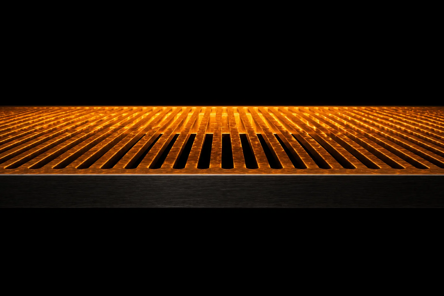 A steel grating carrying a thin film of glowing liquid on top, with black depth visible through its slots.