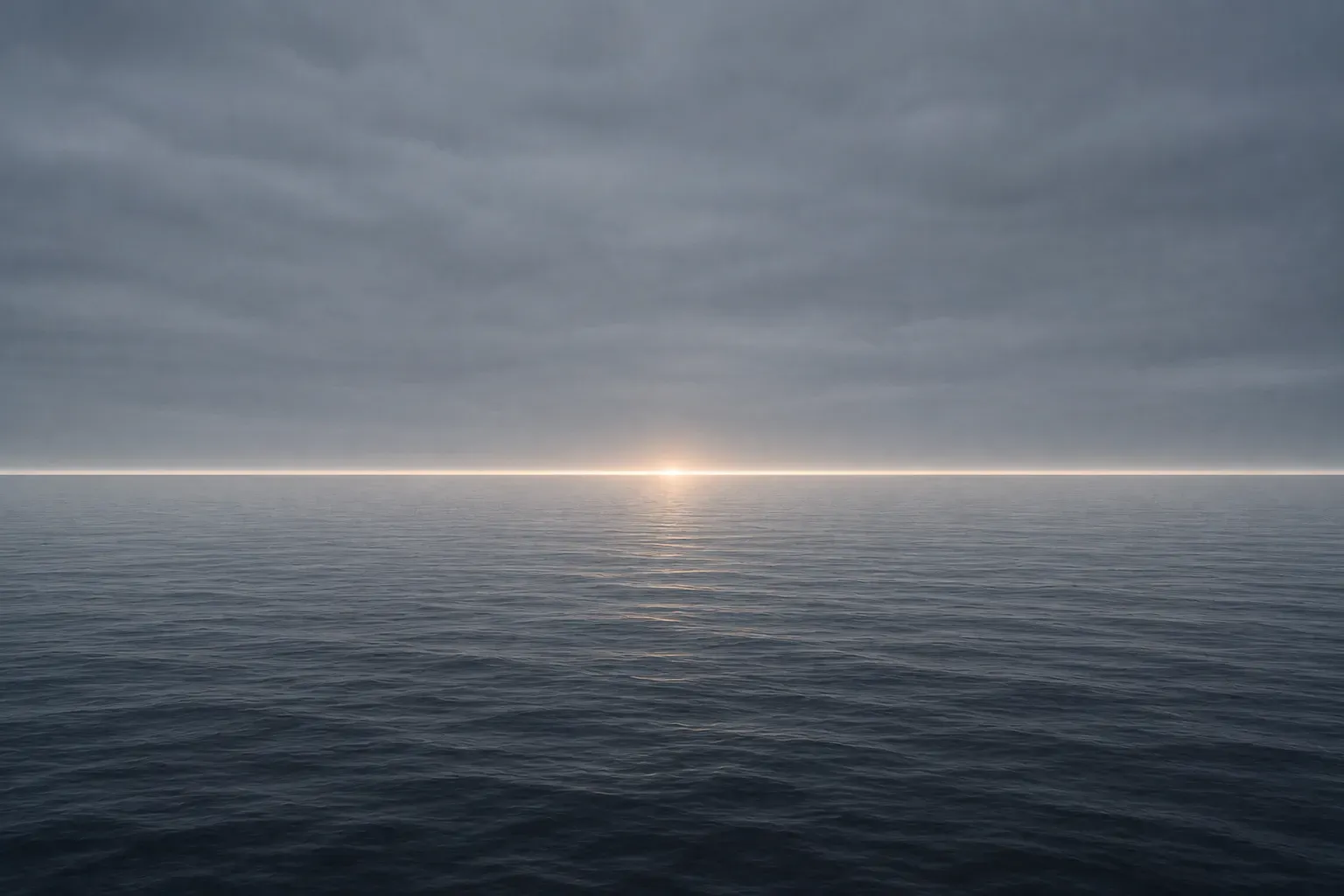A calm sea meeting a flat grey sky, a single thin band of light marking the horizon