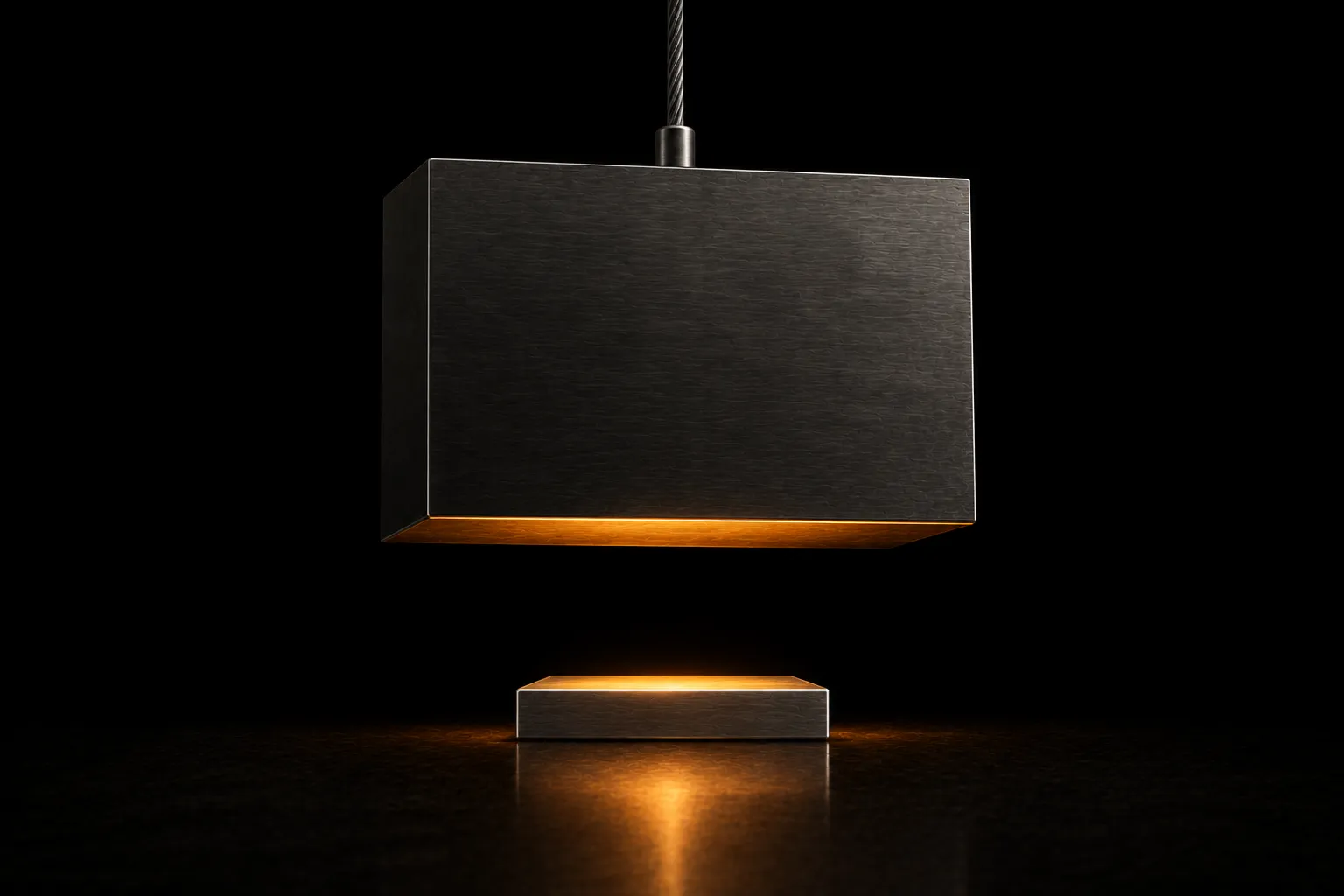 A large steel block hanging from a single cable directly above a much smaller lit platform, with a clear gap between them.